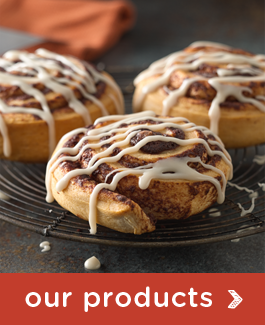 "Our products" with a photo of cinnamon buns on a trivet 